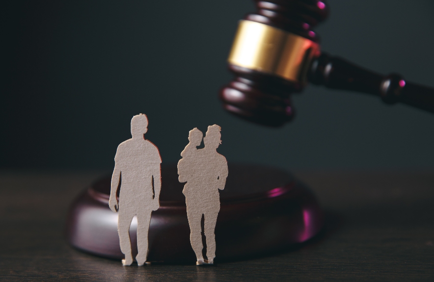 Family figure and gavel on table