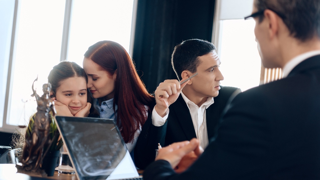 Parents with child are consulting with lawyer