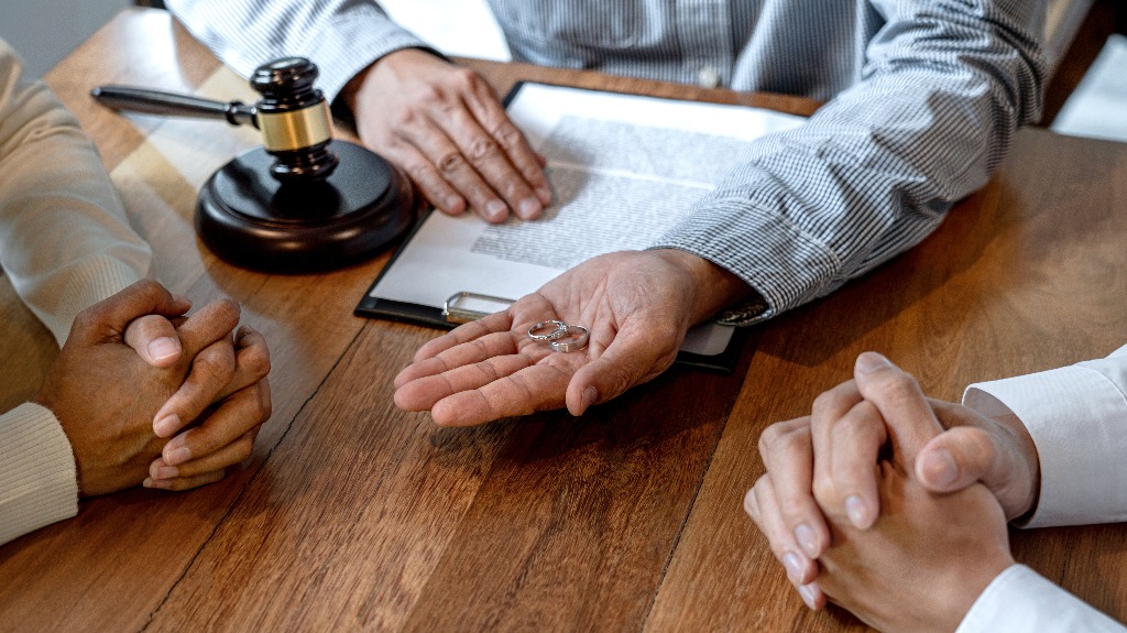 Lawyer is holding wedding rings